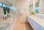 The luxury, remodeled bathroom is a welcoming site after a fun-filled day soaking in the sun